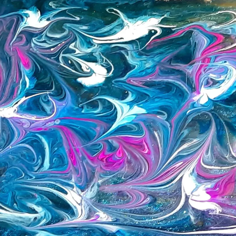 Detail of a wintry epoxy resin pattern, in blue white and mauze, from a long term project to convert an old wooden stepladder into a planter