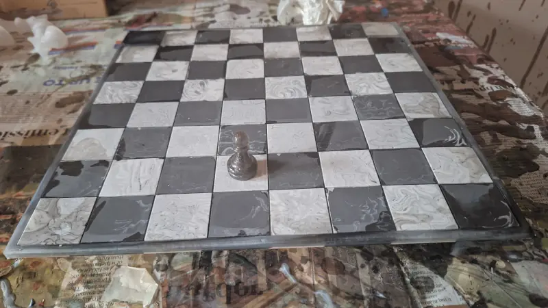 A classic black and white chessboard, mixed media, epoxy resin and jesmonite