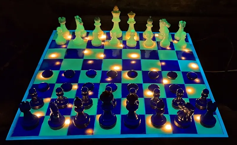 An epoxy resin chessboard with glow in the dark pigments and embedded LED lights