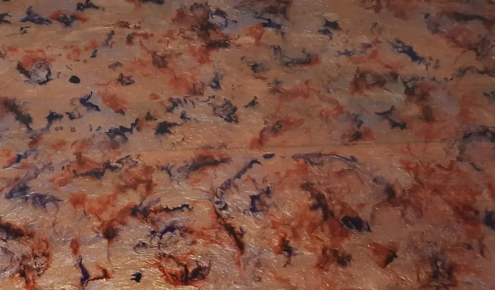 A worktop in epoxy resin, with a pattern fondly referred to by the maker as 'alien vomit'
