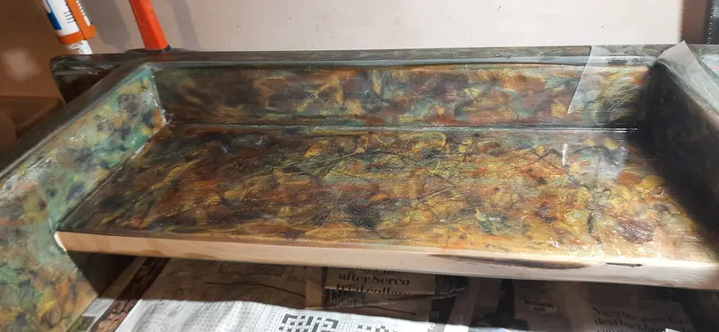 A wooden bench, coated with decorative patterned epoxy resin