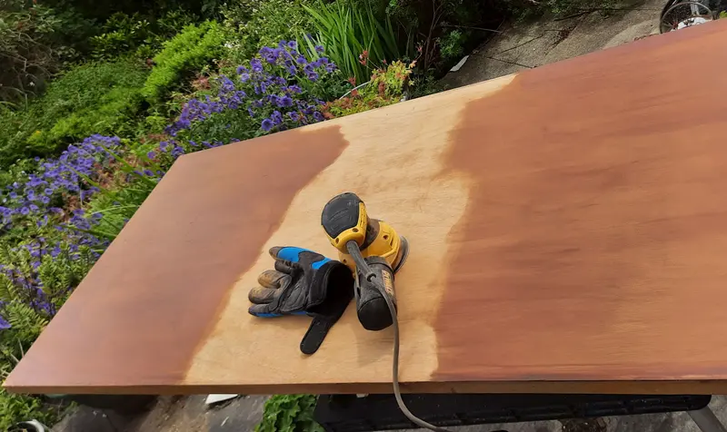 A dreary old wardrobe door, being sanded down