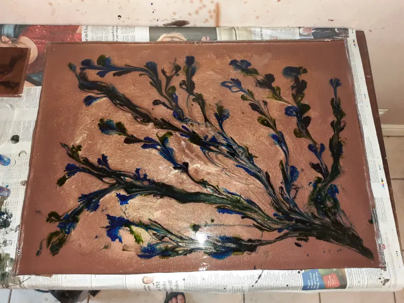A backboard for a cabinet, epoxy resin on MDF, with a thick floral pattern