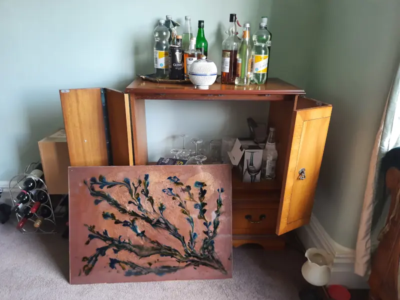 A backboard for a cabinet, epoxy resin on MDF, with a thick floral pattern
