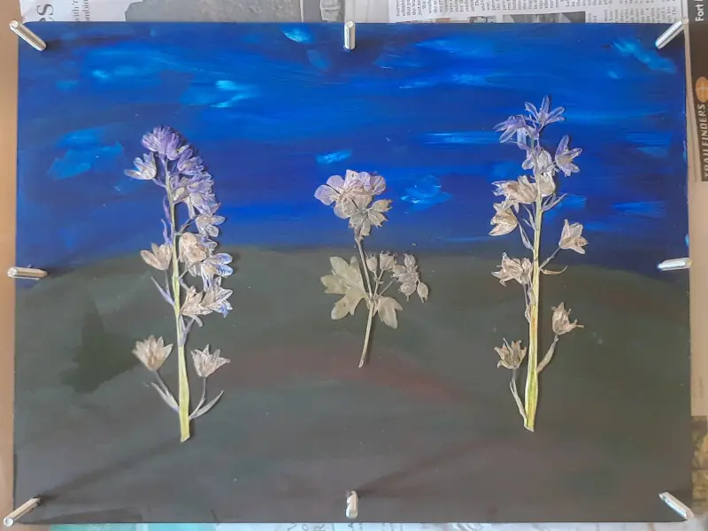 A decorative flower press with dried flowers, work in progress, before pouring epoxy resin