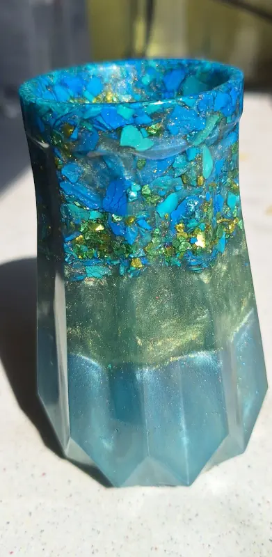 A jar made of epoxy resin and blue and green fragments of jesmonite