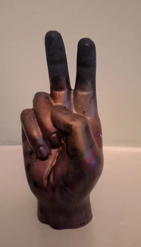 A two-fingered salute, in epoxy resin and jesmonite - take it positively or negatively